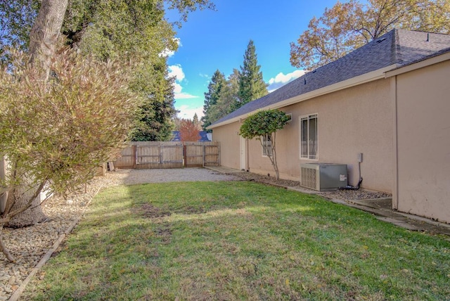 view of yard with central AC