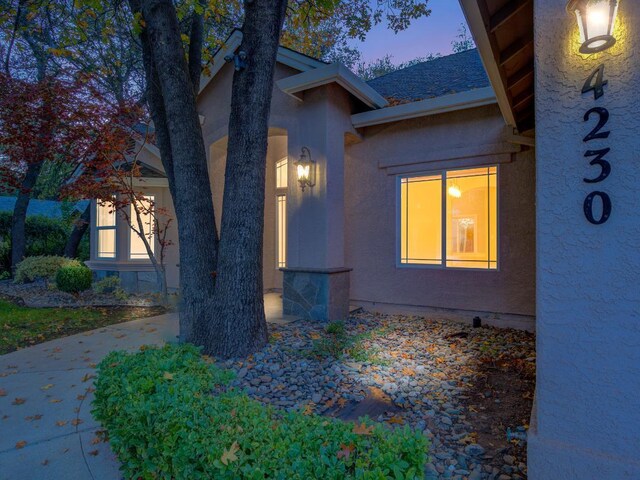 view of property exterior at dusk