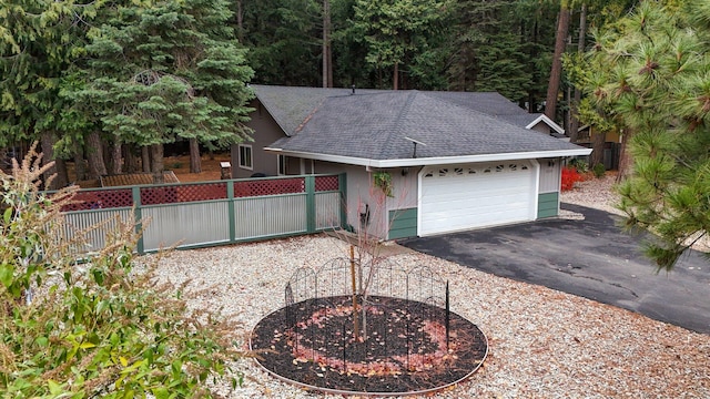 ranch-style home featuring a garage