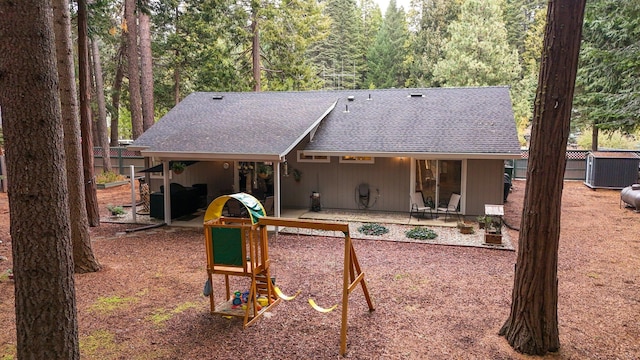 rear view of house with a playground