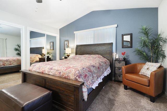 carpeted bedroom with a closet, vaulted ceiling, and ceiling fan