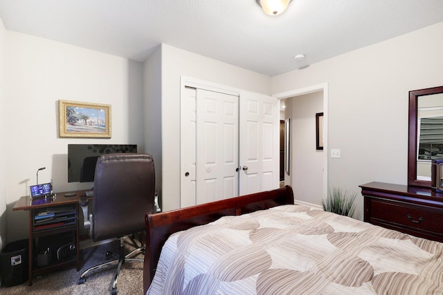 carpeted bedroom with a closet