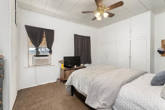 bedroom with carpet flooring, a closet, ceiling fan, and cooling unit