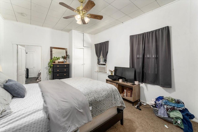 bedroom featuring carpet flooring, ceiling fan, and cooling unit