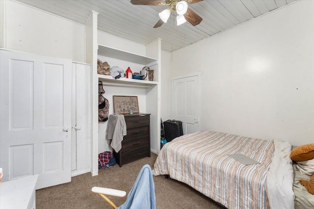 carpeted bedroom featuring ceiling fan and wooden ceiling