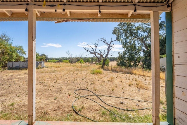 view of yard with a rural view