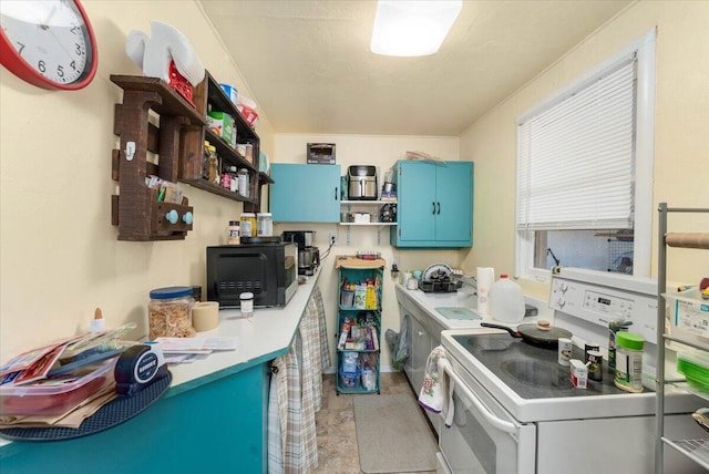 kitchen featuring blue cabinetry and white range