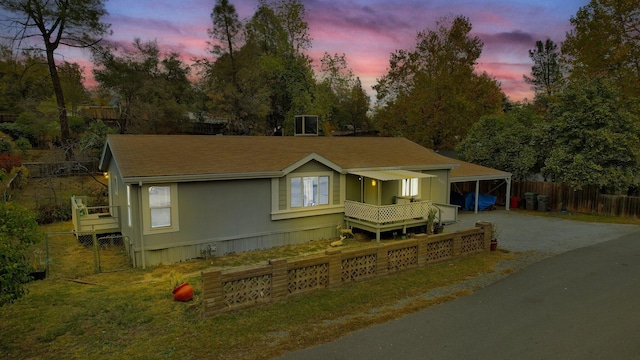 view of front of home featuring a carport