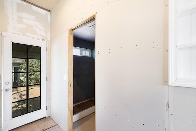 doorway to outside featuring a wealth of natural light