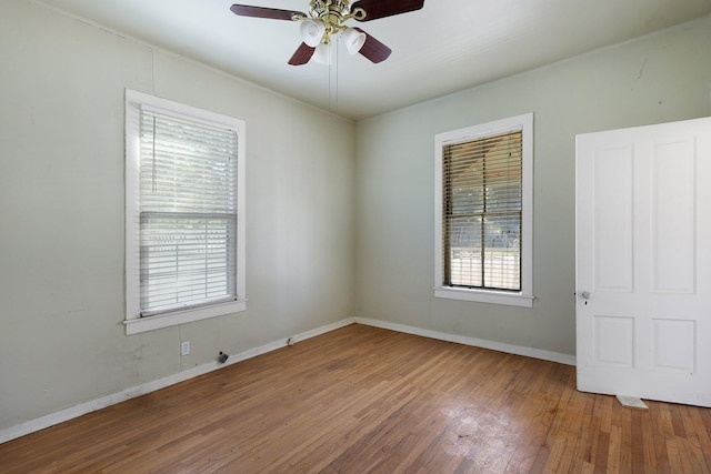 spare room featuring ceiling fan and wood-type flooring