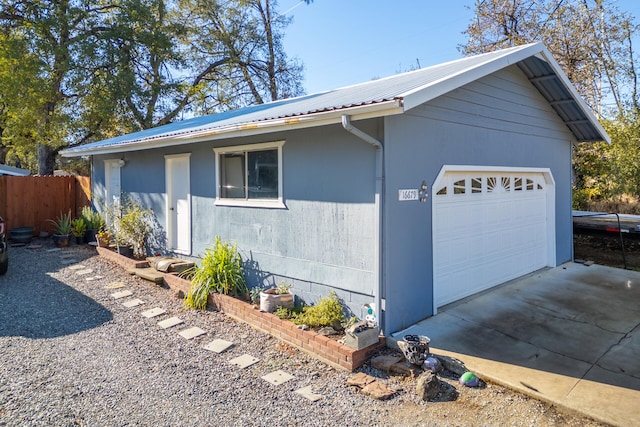 view of property exterior with a garage