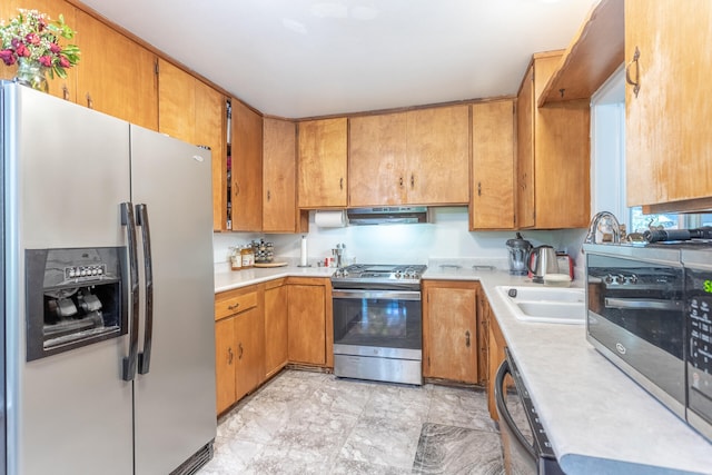 kitchen with sink and appliances with stainless steel finishes