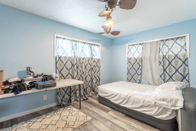 bedroom featuring ceiling fan and light wood-type flooring