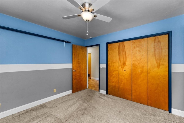 unfurnished bedroom with ceiling fan, a closet, and light colored carpet