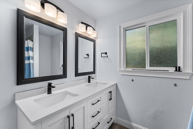 18142 Ranchera Rd, Shasta Lake, CA 96019 - bathroom featuring double vanity and baseboards