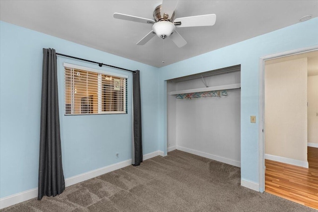 unfurnished bedroom with ceiling fan, carpet floors, and a closet