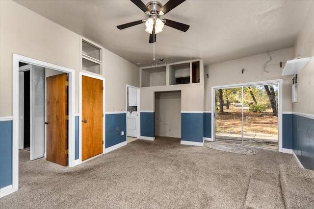 interior space featuring carpet flooring, ceiling fan, built in features, and a textured ceiling