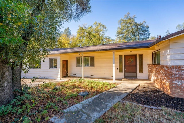 ranch-style home featuring covered porch