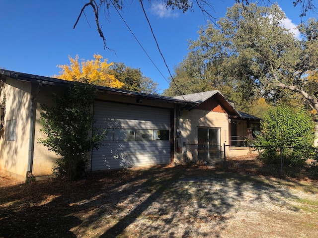 view of home's exterior featuring fence