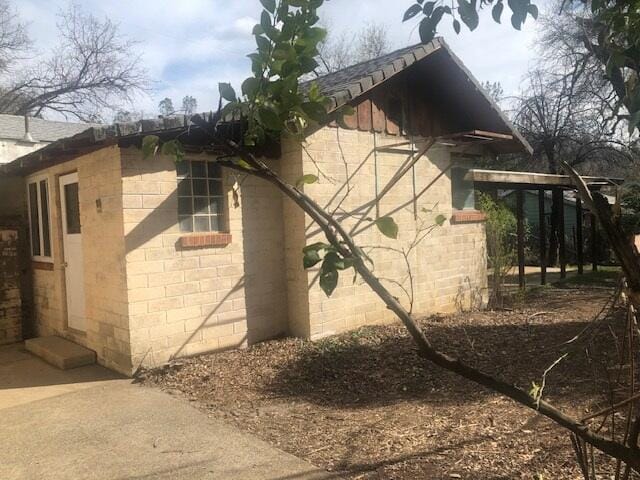 view of home's exterior featuring concrete block siding