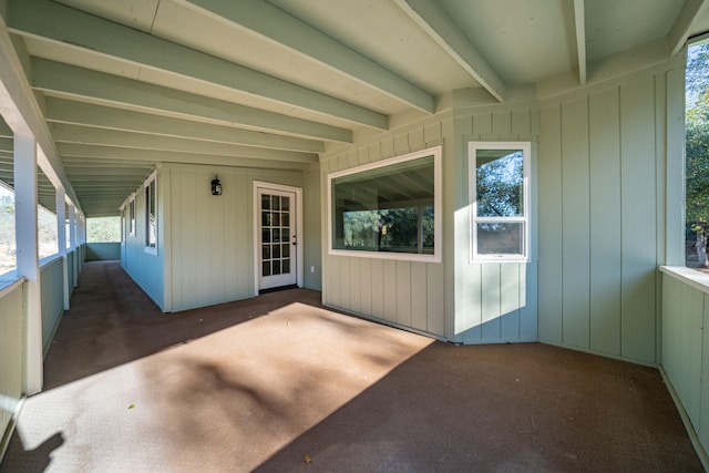 exterior space with beamed ceiling