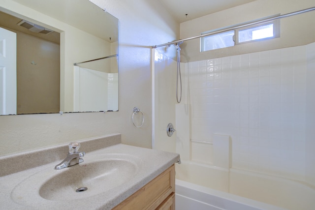 bathroom featuring vanity and shower / bath combination