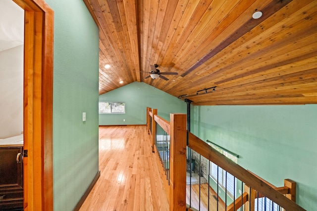 corridor with wooden ceiling, lofted ceiling, and light wood-type flooring