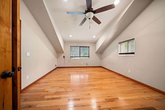 bonus room with light hardwood / wood-style flooring and ceiling fan