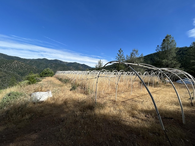 mountain view featuring a rural view