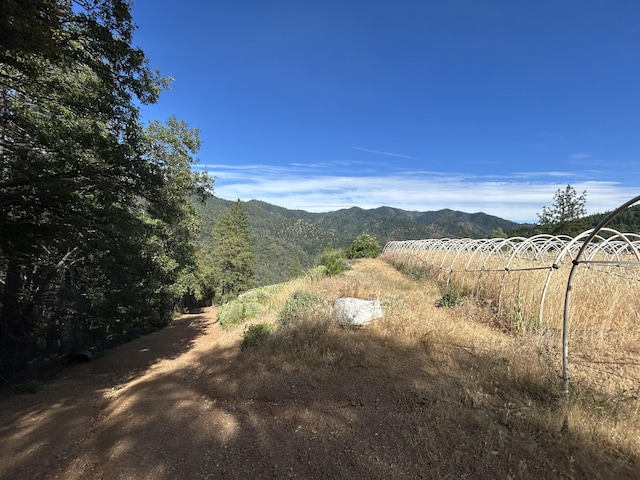 mountain view featuring a rural view