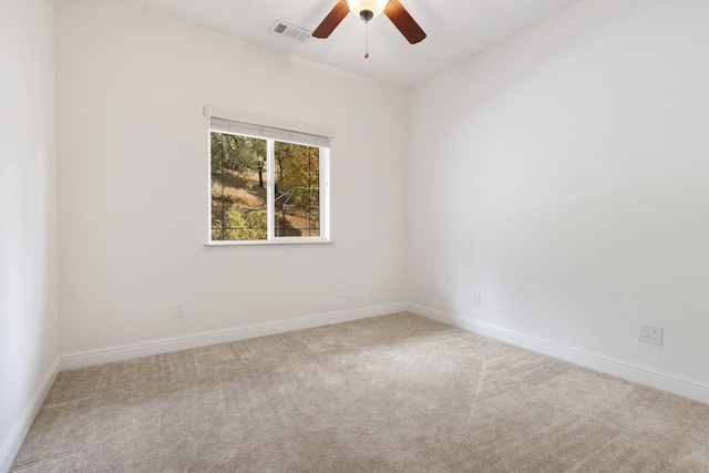 unfurnished room with ceiling fan and carpet floors