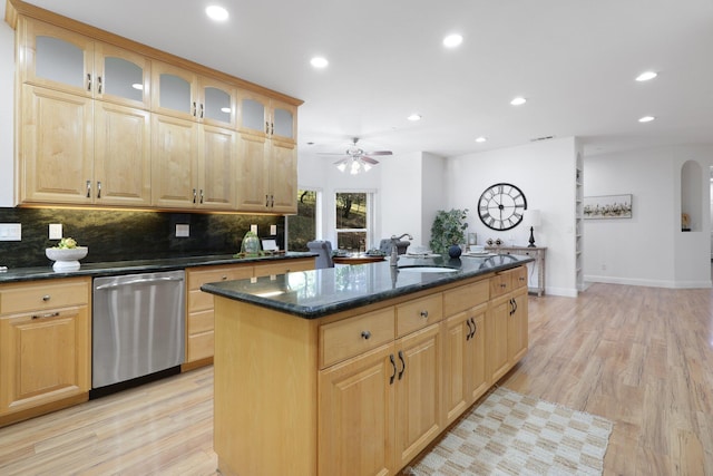 kitchen featuring ceiling fan, dishwasher, a kitchen island, light hardwood / wood-style flooring, and sink