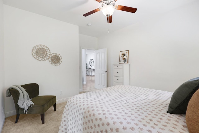 bedroom with light carpet and ceiling fan