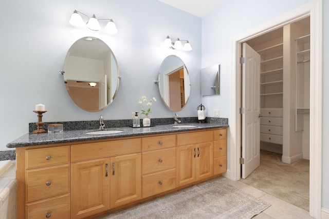 bathroom featuring vanity and tile patterned flooring