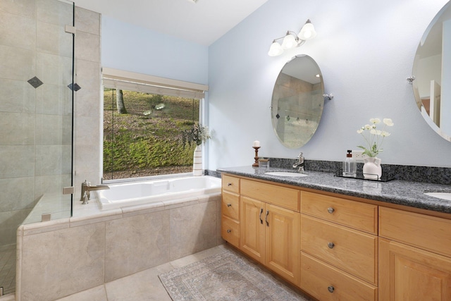 bathroom featuring vanity, tile patterned floors, and independent shower and bath