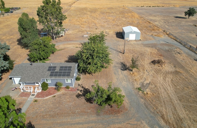 birds eye view of property with a rural view