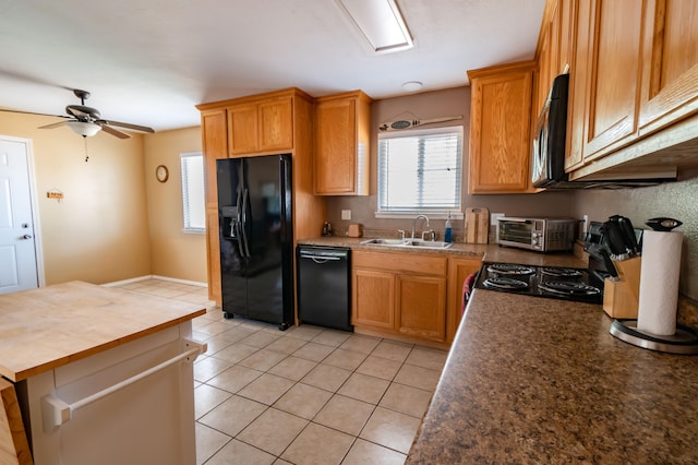 kitchen with ceiling fan, sink, light tile patterned floors, and black appliances