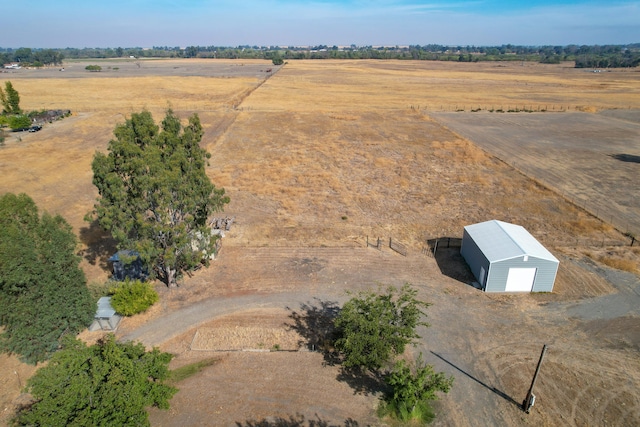 birds eye view of property featuring a rural view