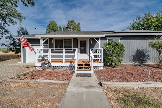 view of front of house with a garage and covered porch