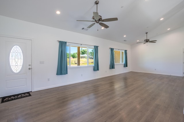 foyer featuring dark hardwood / wood-style floors, ceiling fan, and lofted ceiling