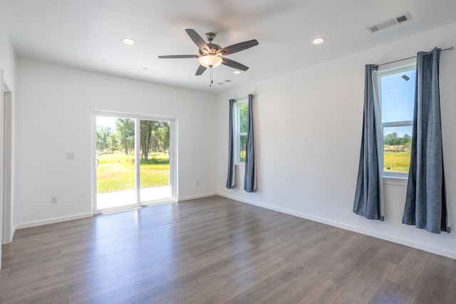 empty room with wood-type flooring and ceiling fan