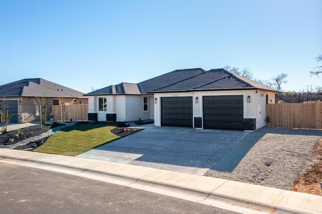 ranch-style home with a garage and a front lawn