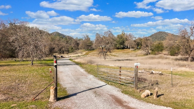 view of road with a mountain view and a rural view