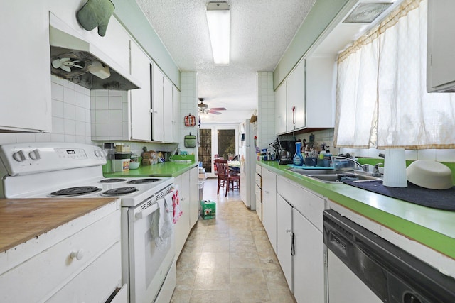 kitchen featuring white cabinets, white electric stove, ceiling fan, and dishwashing machine