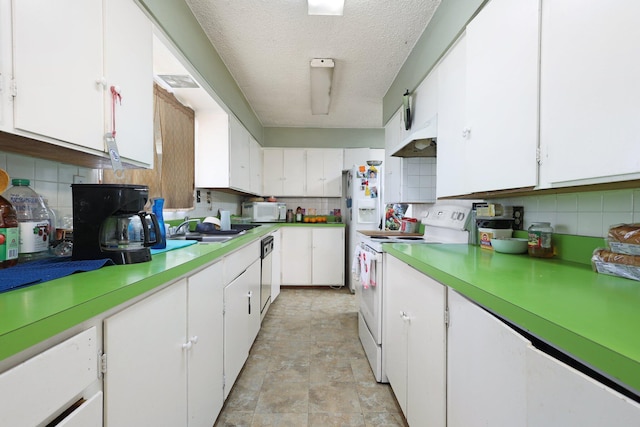 kitchen with decorative backsplash, sink, white cabinets, and white appliances