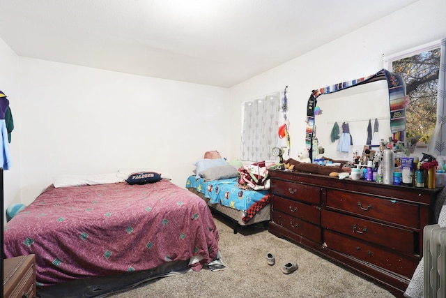 carpeted bedroom featuring radiator heating unit