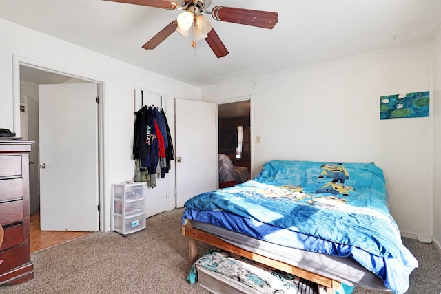 bedroom with ceiling fan and carpet floors