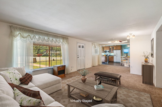 living area featuring light carpet