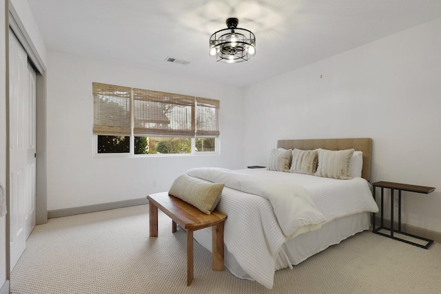 carpeted bedroom featuring a closet