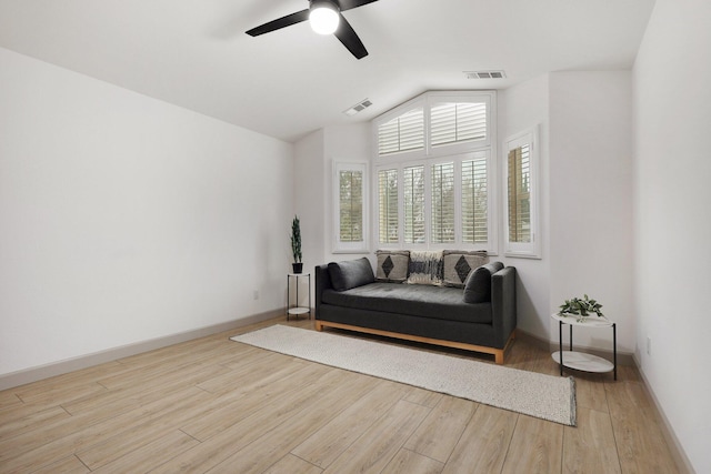 sitting room featuring ceiling fan, lofted ceiling, and light hardwood / wood-style flooring